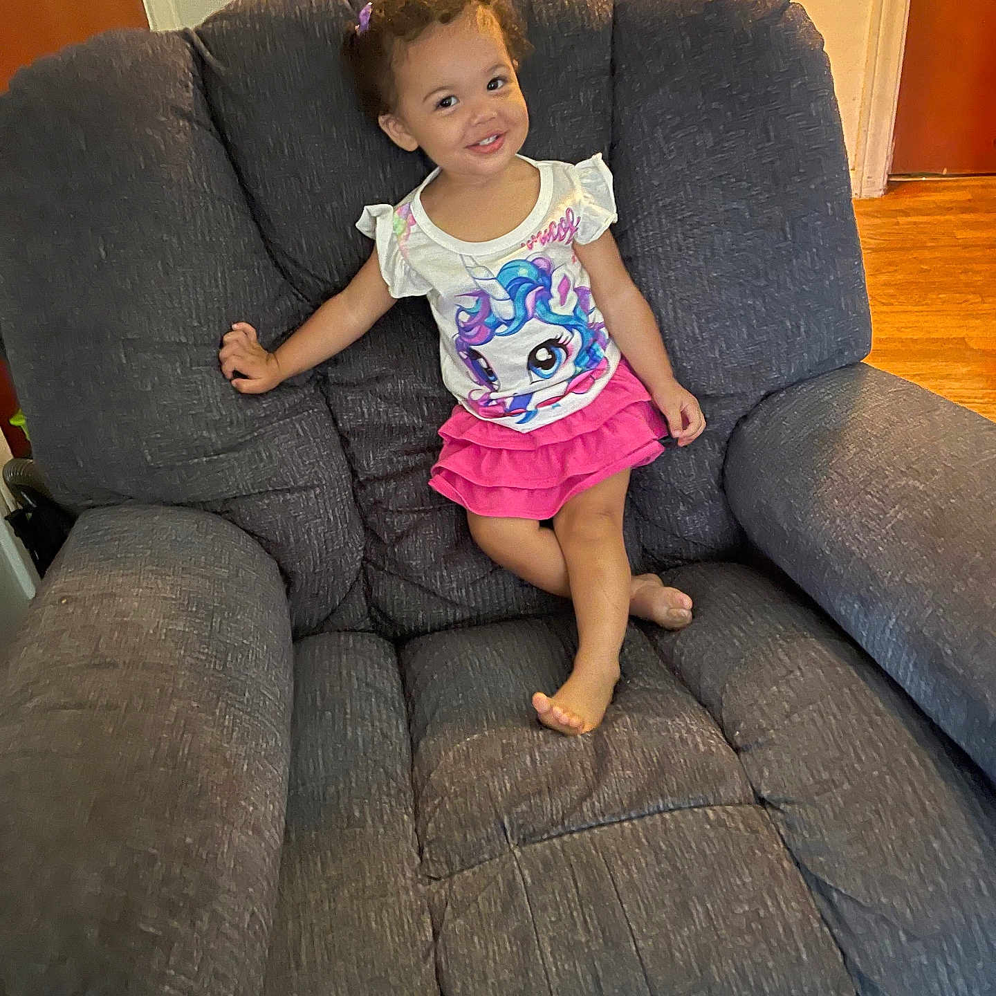 Ariana joined the competition — help win amazing prizes! architecture, armchair, building, chair, child, couch, cushion, face, female, furniture, girl, head, homedecor, indoors, livingroom, person, photography, portrait, room, sitting