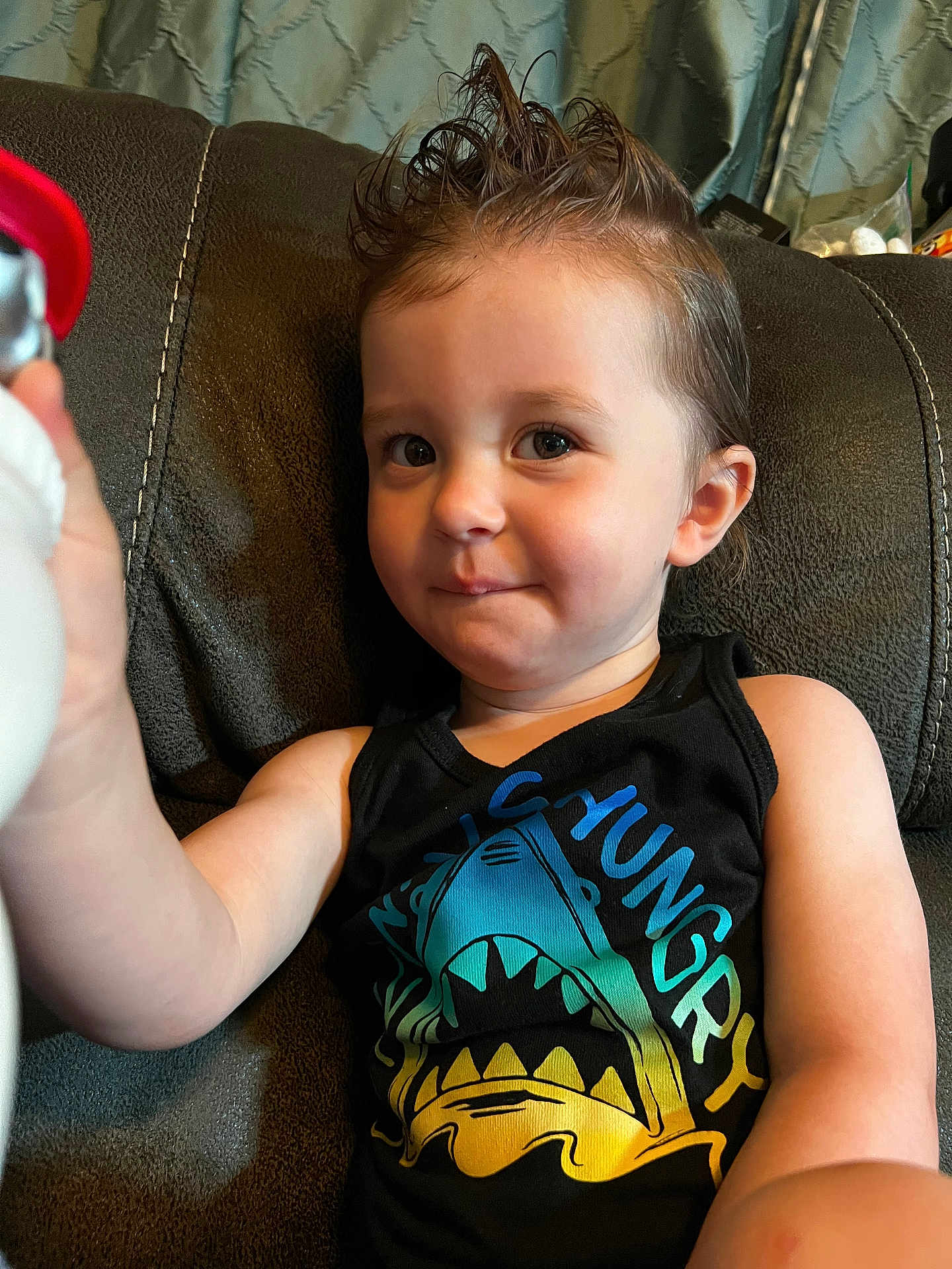 Levi joined the competition — help win amazing prizes! child, toddler, smiling, tank_top, shark_graphic, spiked_hair, indoor, couch, upclose, person, happy, cute, skin, face, arm, furniture, young_child, casual_clothing, playful, portrait