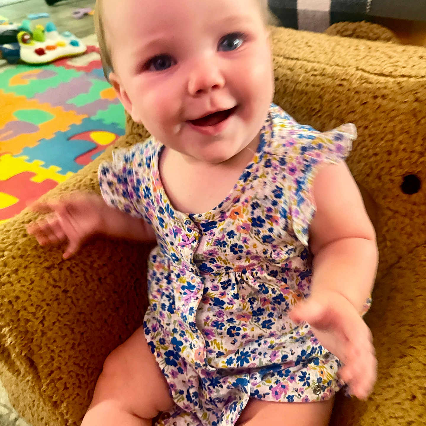 Rosealeine joined the competition — help win amazing prizes! armchair, baby, blue_eyes, child, close_up, couch, daylight, floral_pattern, happy, home, indoor, infant, living_room, play_mat, playroom, portrait, romper, sitting, smiling, toy