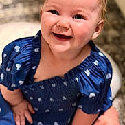 Rosealeine is registered to the contest to win money with this photo: baby, blue_dress, cheerful, child, close_up, couch, cozy, eyes, face, happy, heart_pattern, indoor, infant, mouth, outdoor, photography, portrait, sitting, smiling, soft_lighting
