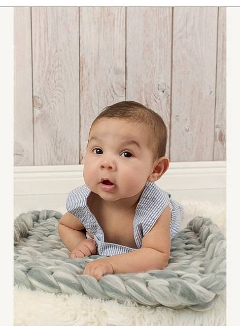 Angel is registered to the contest to win money with this photo: baby, baby_toddler_clothing, cheek, child, collar, comfort, flash_photography, flooring, happy, linens, pattern, person, portrait, portrait_photography, sitting, skin, sleeve, smile, surprise, t_shirt