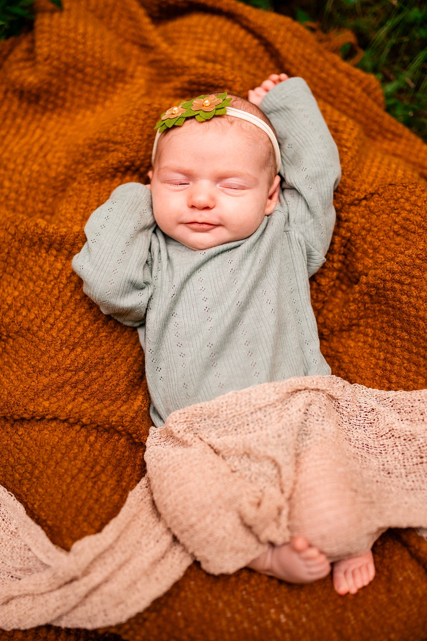 Evee is registered to the contest to win money with this photo: baby, baby_toddler_clothing, cheek, child, comfort, eye, face, grass, head, headgear, linens, orange, peach, person, sitting, skin, sleeve, textile, toddler, wood