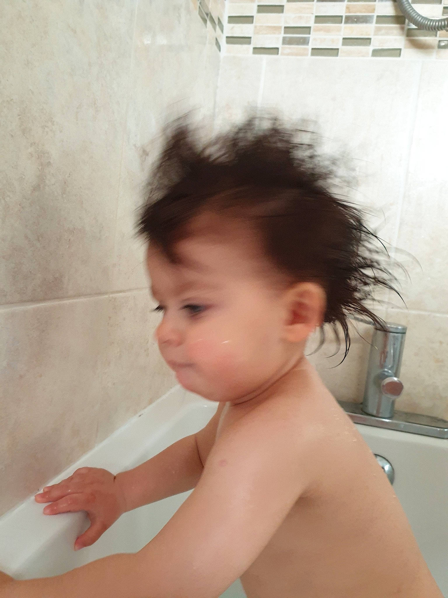 Matteo is registered to the contest to win money with this photo: baby, barechested, bathing, bathtub, beauty, chest, child, chin, ear, face, forehead, hair, hairstyle, hand, joint, neck, person, room, shoulder, skin