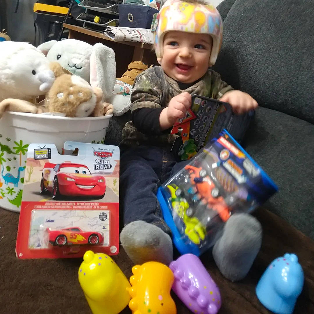 Caden is registered to the contest to win money with this photo: baby, baby_toys, car, child, fun, gadget, headwear, joy, motor_vehicle, person, personal_protective_equipment, plastic, play, product, recreation, smile, stuffed_toy, technology, toddler, toy