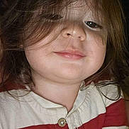 Ethan is registered to the contest to win money with this photo: child, toddler, face, smile, hair, long_hair, striped_clothing, red_stripes, white_stripes, buttoned_shirt, portrait, close_up, human, casual_wear, indoors, young_child, cute, chubby_cheeks, happy, person