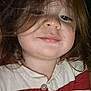 child, toddler, face, smile, hair, long_hair, striped_clothing, red_stripes, white_stripes, buttoned_shirt, portrait, close_up, human, casual_wear, indoors, young_child, cute, chubby_cheeks, happy, person