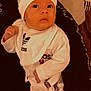 Ménélas a rejoint le concours — aidez-le/la à gagner de superbes lots ! baby, infant, child, adidas, clothing, hat, bib, sleepsuit, person, face, eyes, hand, couch, blanket, fabric, portrait, indoor, cute, apparel, cozy