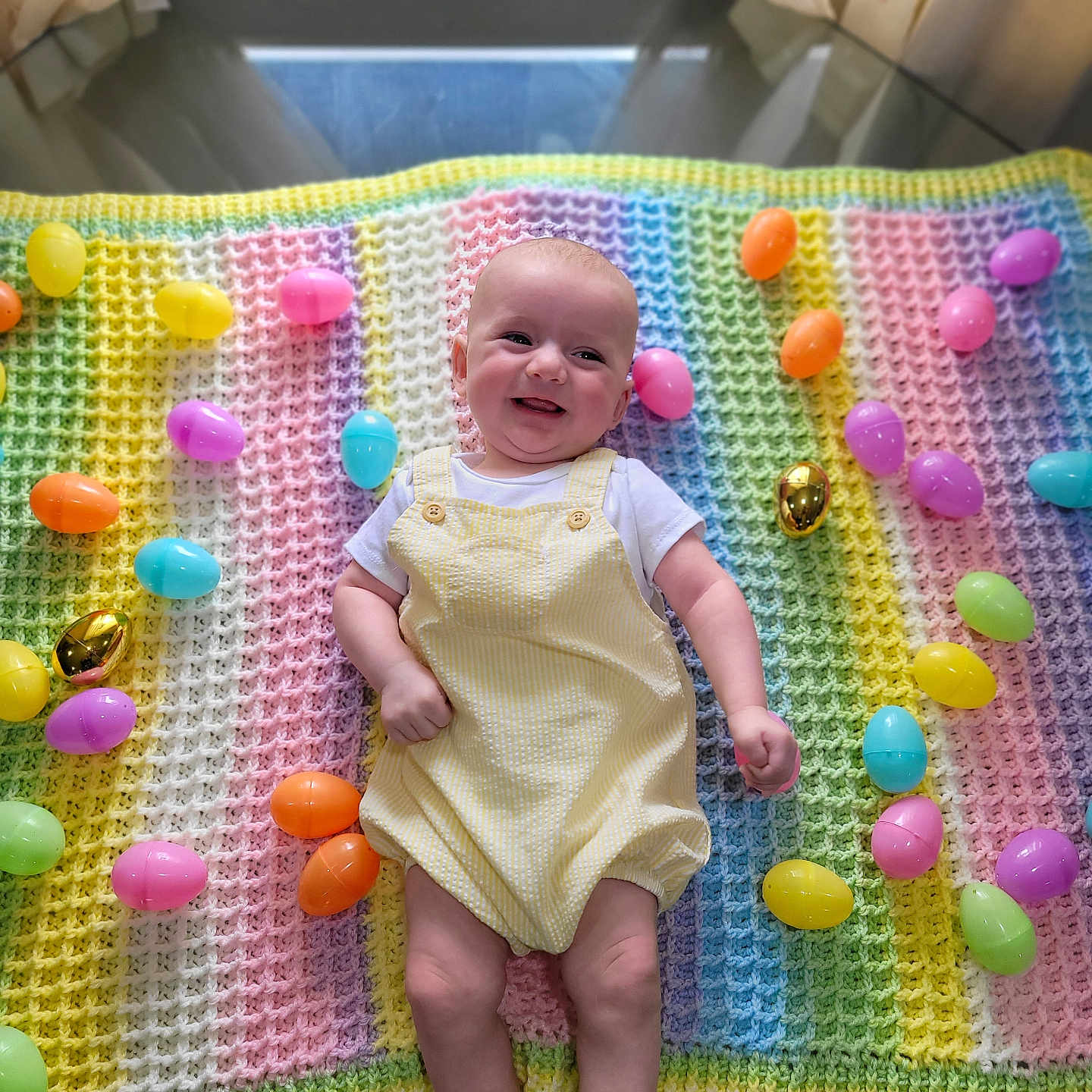 Desmond is registered to the contest to win money with this photo: baby, balloon, blanket, clothing, cushion, egg, face, food, happy, head, homedecor, hosiery, medication, person, photography, pill, portrait, purple, quilt, sock