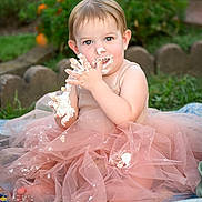Adilynn is registered to the contest to win money with this photo: toddler, child, cake_smash, pink_tutu, frosting, messy, outdoor, garden, flowers, grass, quilt, cute, baby, happy, playful, celebration, portrait, summer, fun, sitting
