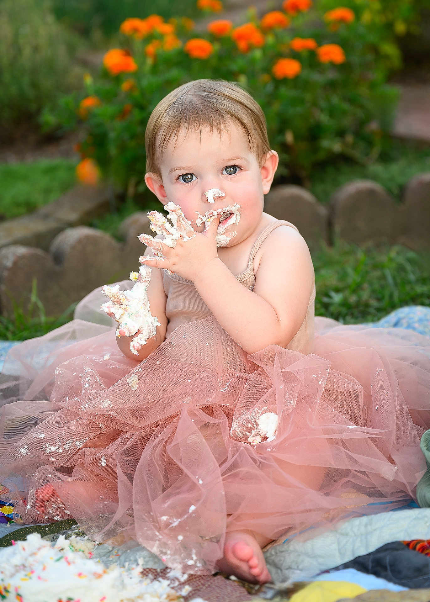 Adilynn is registered to the contest to win money with this photo: toddler, child, cake_smash, pink_tutu, frosting, messy, outdoor, garden, flowers, grass, quilt, cute, baby, happy, playful, celebration, portrait, summer, fun, sitting