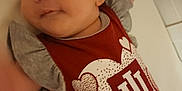 Adilynn is registered to the contest to win money with this photo: applique, baby, bed, blanket, bodypart, clothing, crib, face, finger, furniture, hand, head, infantbed, newborn, pattern, person, photography, portrait, shirt, t_shirt