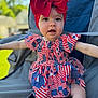 Tatum joined the competition — help win amazing prizes! american_flag_pattern, baby, chair, child, colorful, cute, dress, fashion, happy, headband, headwear, infant, outdoor, person, portrait, red_bow, sitting, smiling, summer, young