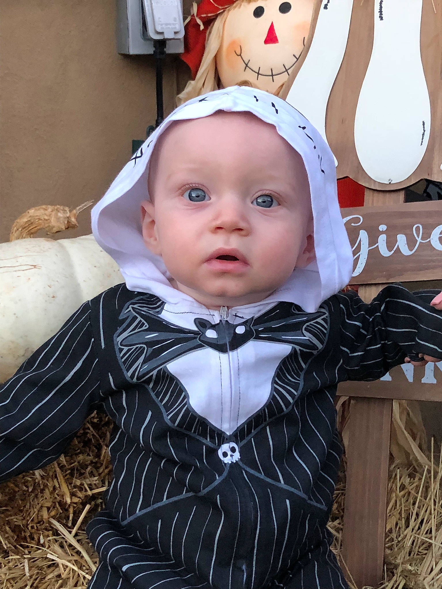 Brady is registered to the contest to win money with this photo: baby, cheek, child, costume, ear, face, head, outerwear, person, skin, toddler
