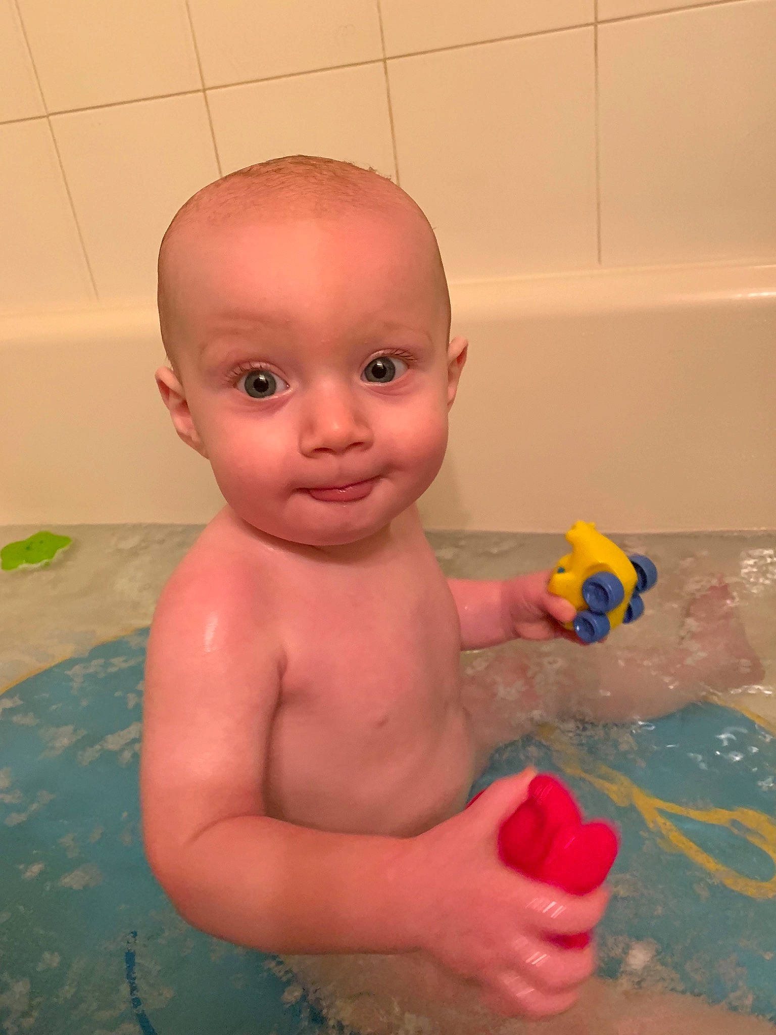 Brady joined the competition — help win amazing prizes! baby, baby_bathing, bath_toy, bathing, bathtub, chest, child, head, mouth, person, product, rubber_ducky, toddler, toy, trunk, washing