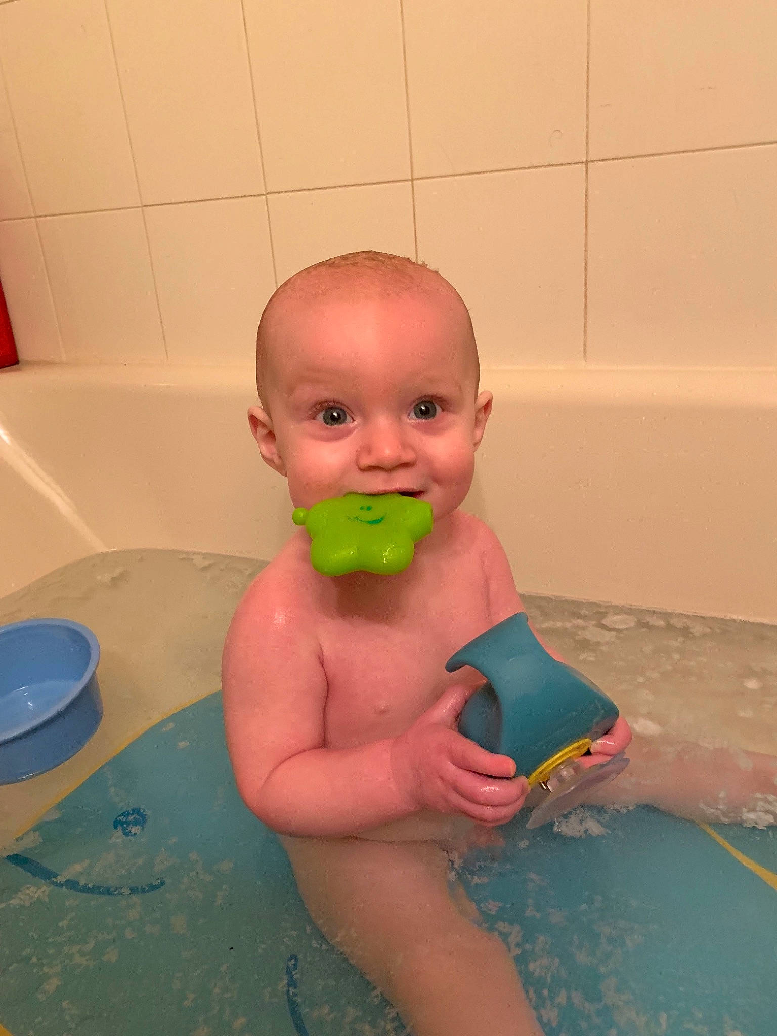 Brady is registered to the contest to win money with this photo: baby, baby_bathing, bath_toy, bathing, bathtub, child, fun, head, person, toddler, washing