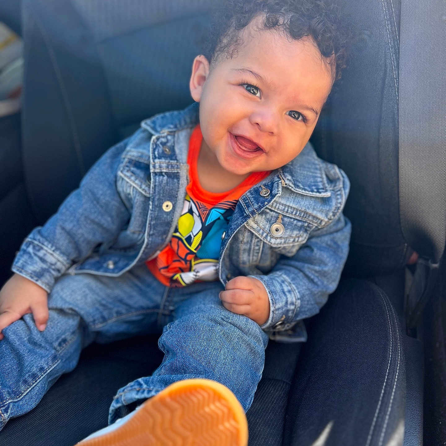 Daleno is registered to the contest to win money with this photo: baby, babylaughing, clothing, coat, face, footwear, hair, happy, head, jacket, jeans, laughing, pants, person, photography, portrait, shoe, sitting, sleeve, smile