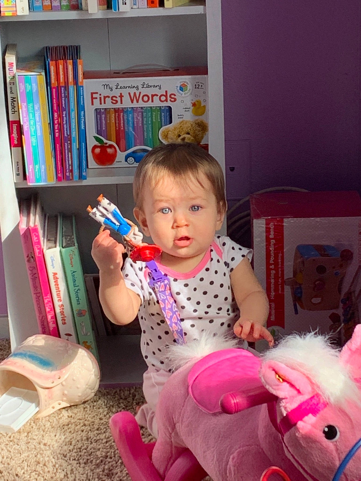 Dahlia is registered to the contest to win money with this photo: baby, child, person, pink, play, room, sitting, smile, toddler, toy