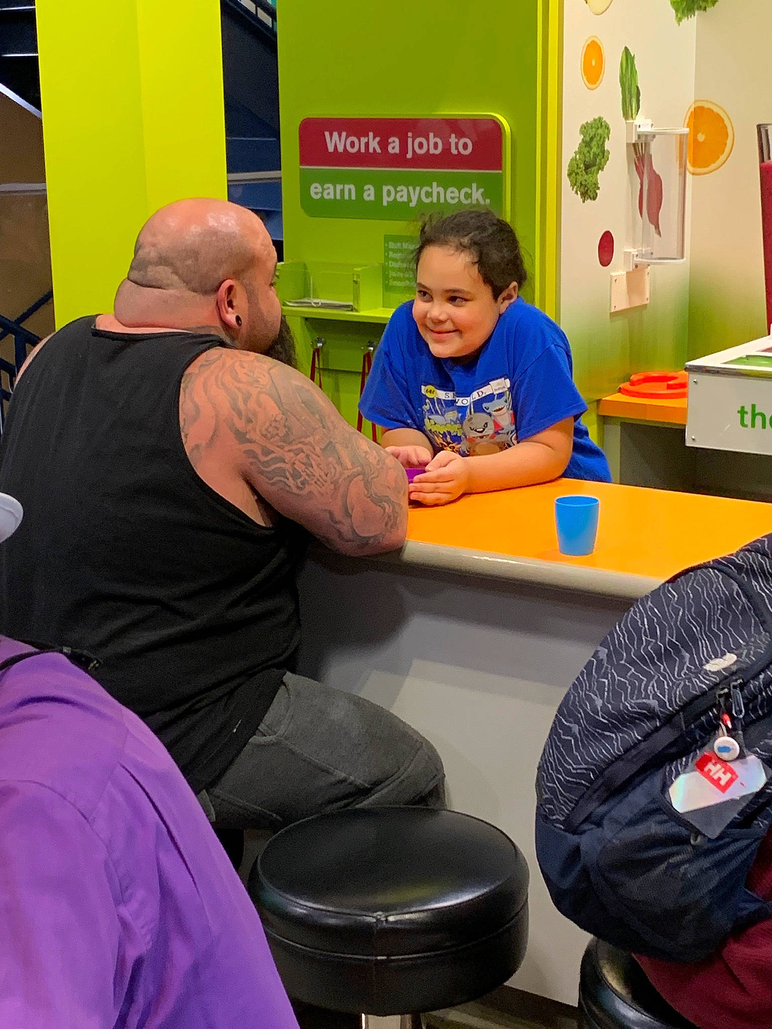 Riot is registered to the contest to win money with this photo: child, joy, person, room, sitting