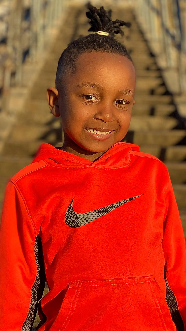 Keontae joined the competition — help win amazing prizes! adaptation, child, face, facial_expression, forehead, fun, hairstyle, happy, head, iris, jewellery, joy, lip, nose, orange, person, skin, sleeve, smile, standing