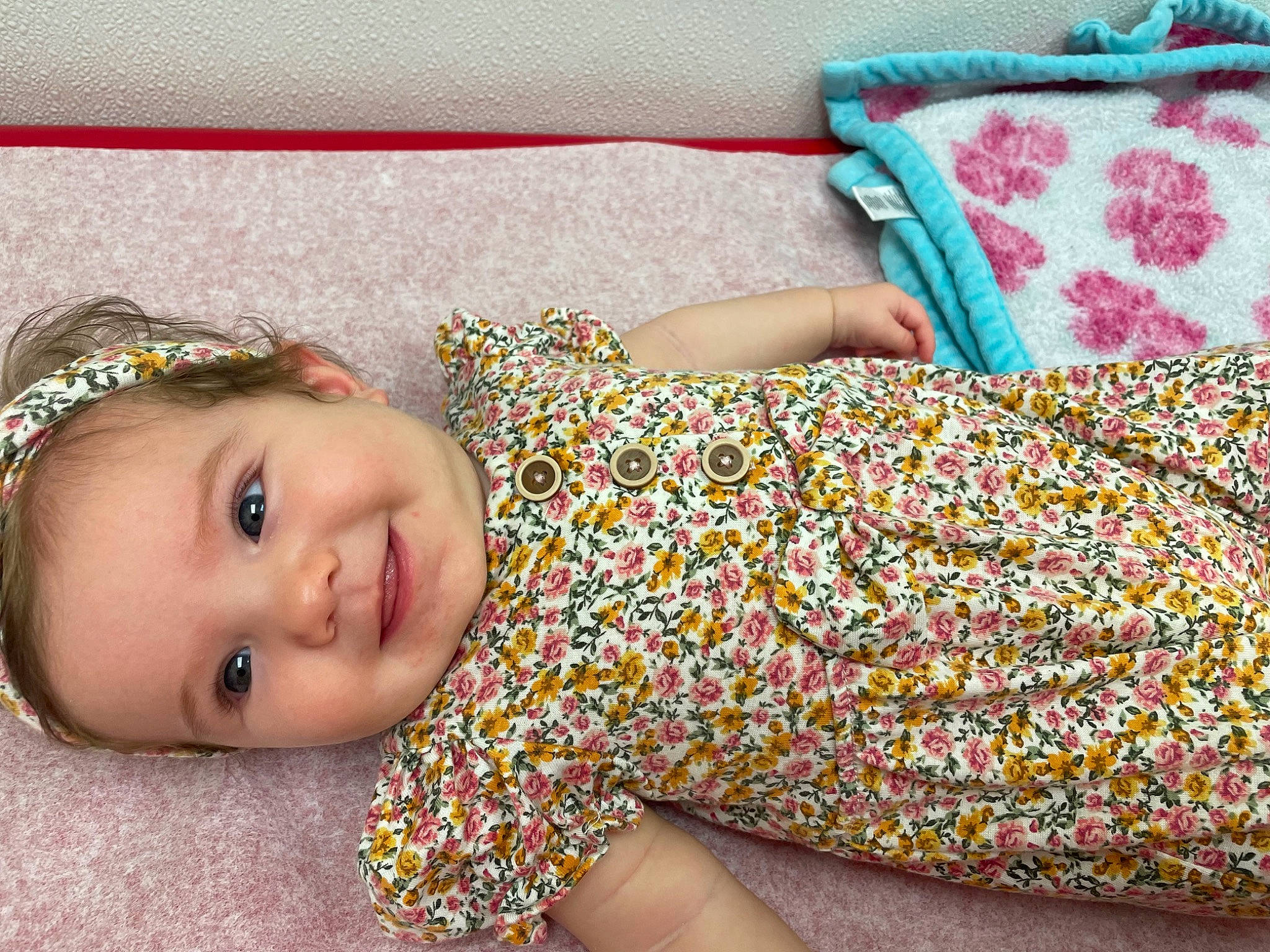 Madison is registered to the contest to win money with this photo: baby_toddler_clothing, bedding, child, craft, design, face, fashion_accessory, grass, green, happy, headband, human_leg, joy, linens, pattern, people_in_nature, person, product, smile, textile