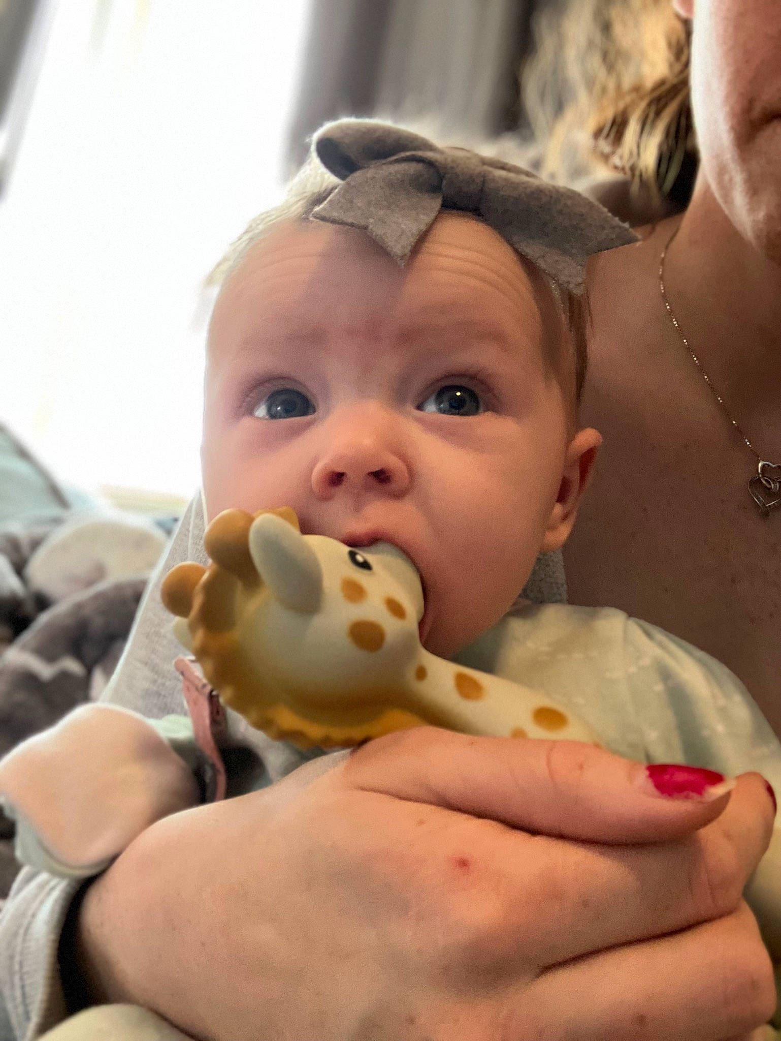 Esther is registered to the contest to win money with this photo: baby, cheek, child, finger, fun, gesture, happy, iris, jewellery, leisure, mouth, nail, nose, person, skin, stuffed_toy, thumb, toddler, vacation