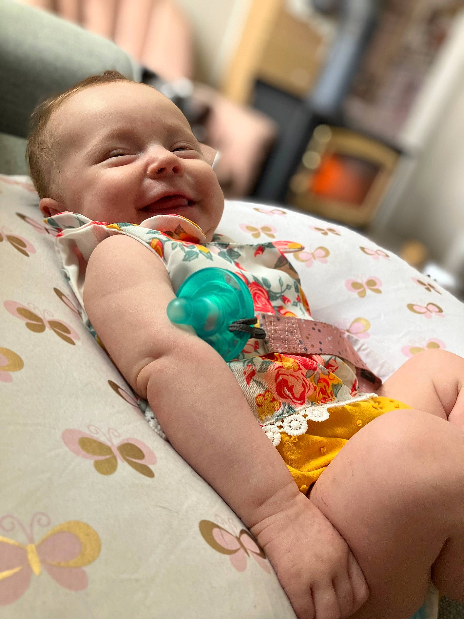 Esther is registered to the contest to win money with this photo: baby, baby_products, baby_toddler_clothing, child, comfort, event, finger, fun, happy, human_leg, nail, person, room, skin, smile, thumb, toddler