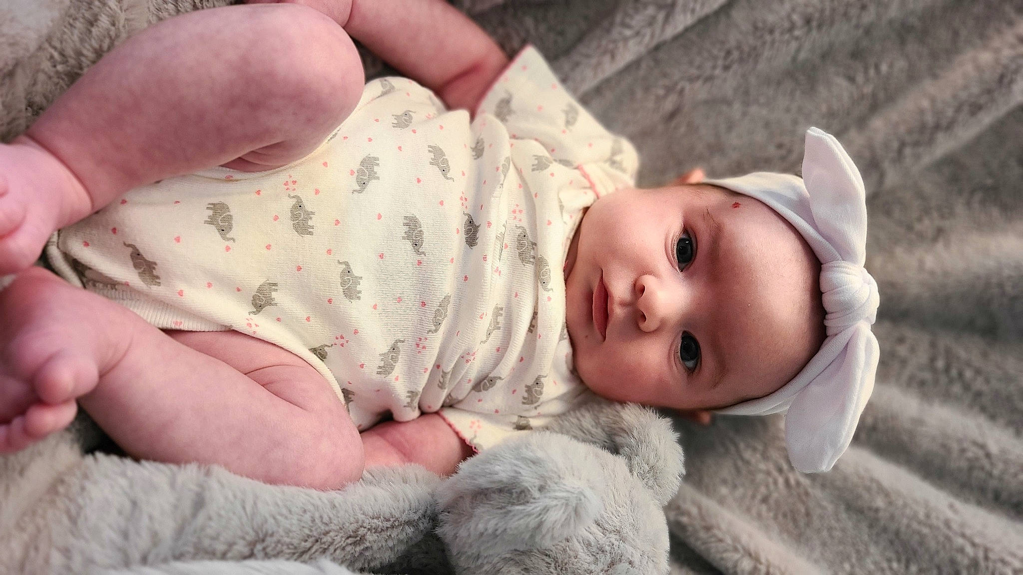 Savannah joined the competition — help win amazing prizes! baby, baby_toddler_clothing, cheek, child, close_up, comfort, eyelash, finger, gesture, grass, hat, headgear, headwear, lip, nose, person, skin, sleeve, textile, thumb