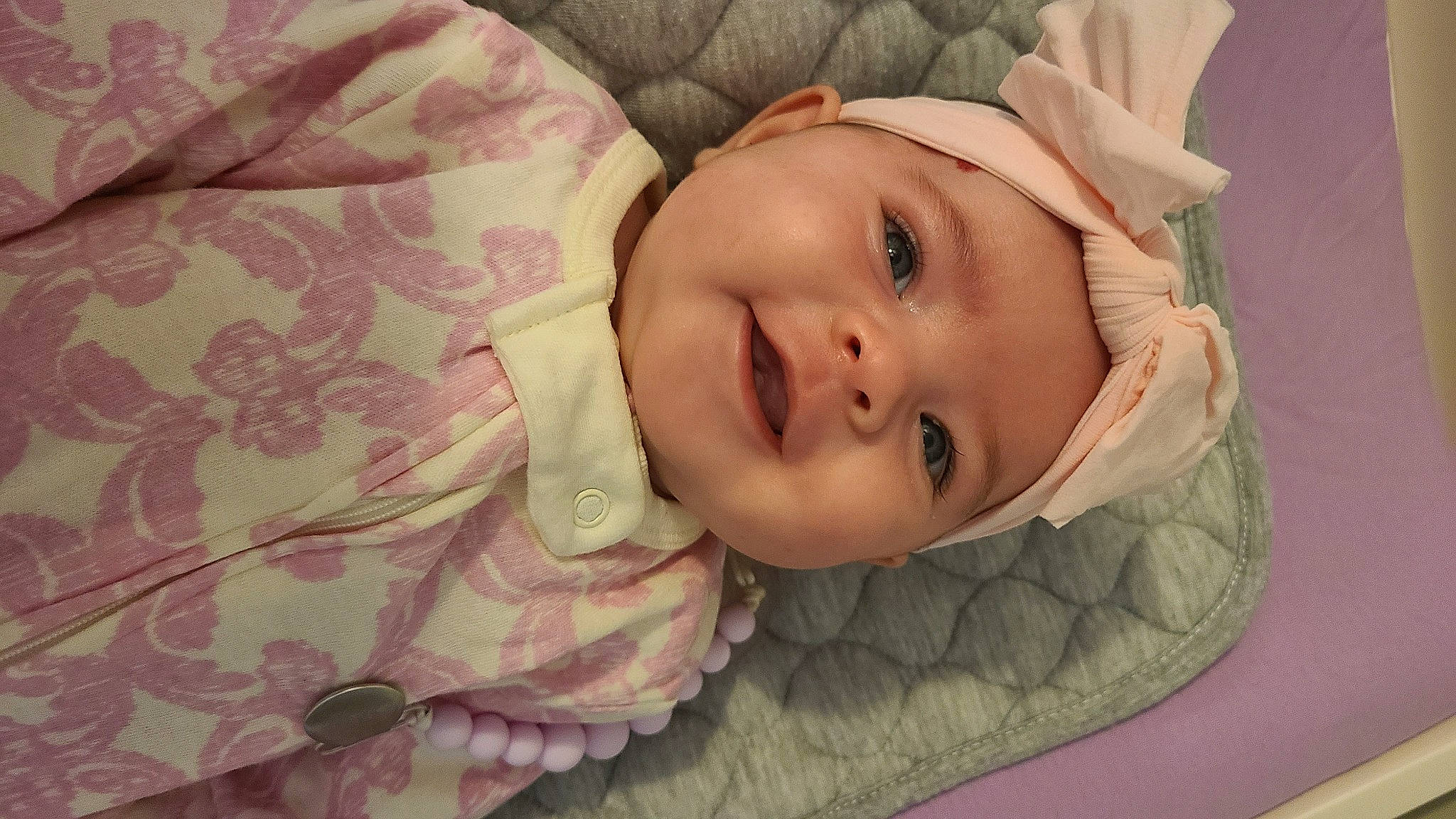 Savannah is registered to the contest to win money with this photo: baby, baby_toddler_clothing, cheek, comfort, eye, eyebrow, eyelash, happy, hat, head, headwear, iris, linens, lip, nose, person, pink, skin, sleeve, smile