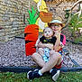 baby, carrot, cartoon, child, cute, garden, glasses, grass, hat, nature, outdoor, person, playful, rabbit, shoes, sitting, smile, stone_wall, summer, thumbs_up