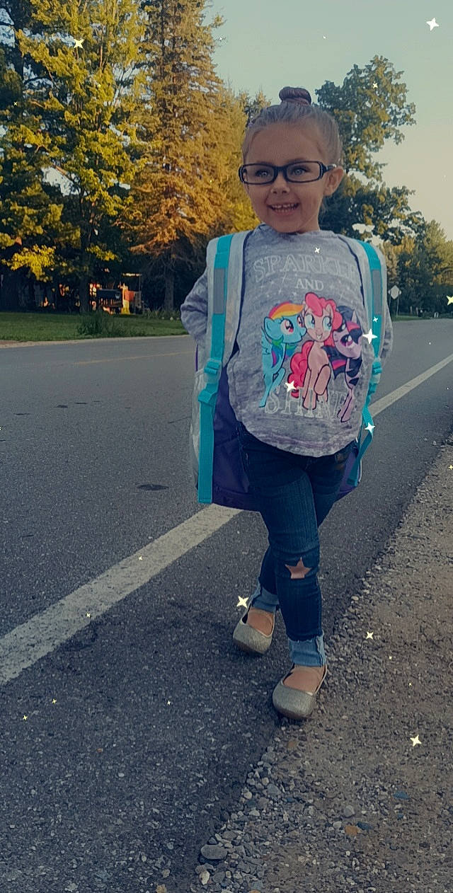 Taylah is registered to the contest to win money with this photo: asphalt, denim, electric_blue, eyewear, fun, grass, happy, head, joy, leisure, pattern, person, plant, recreation, road, road_surface, sidewalk, sleeve, sportswear, t_shirt