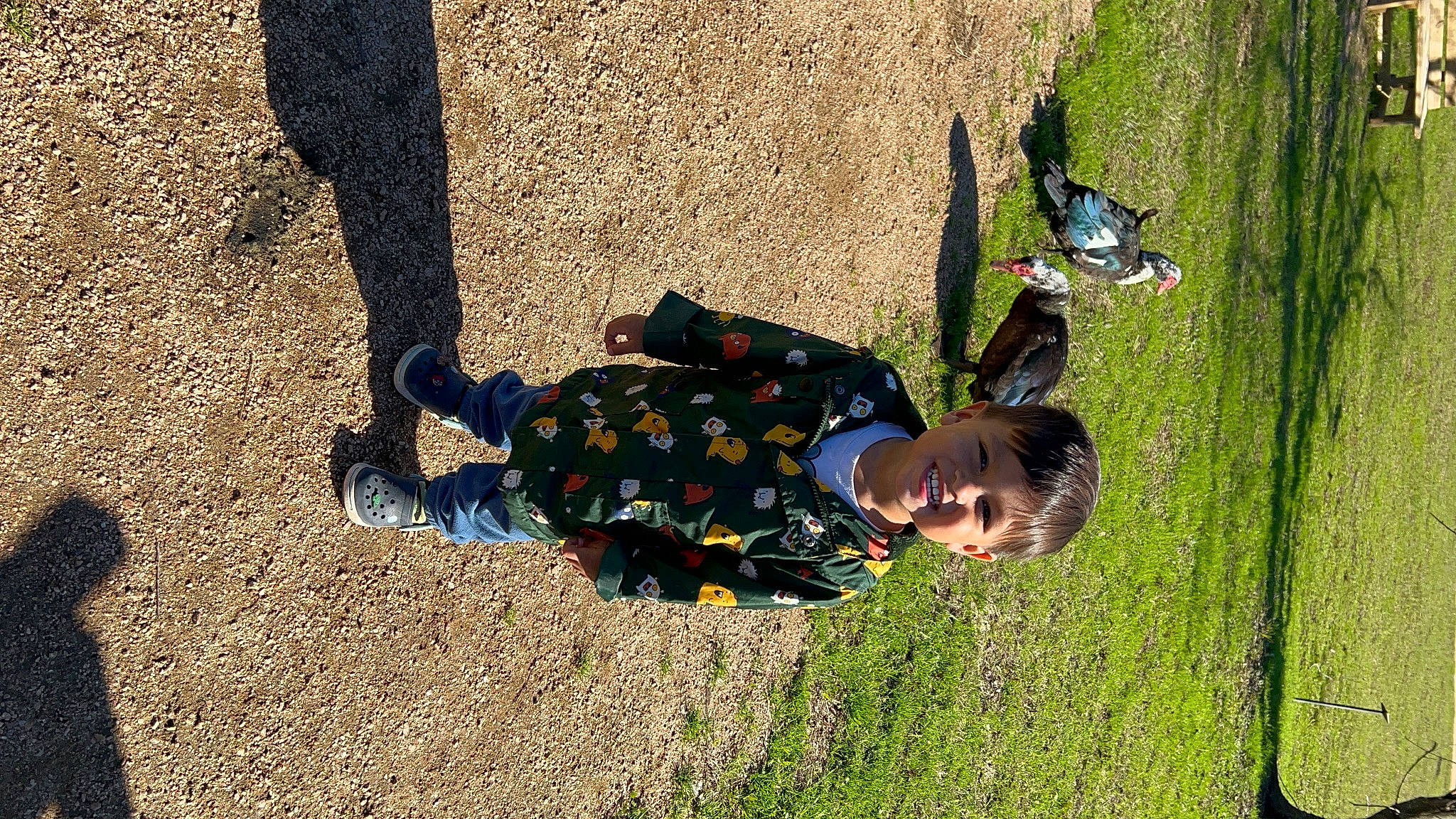 Armani is registered to the contest to win money with this photo: child, flooring, fun, grass, grass_family, happy, joy, leisure, pattern, people_in_nature, person, plant, play, recreation, shadow, sitting, smile, soil, toddler, tree