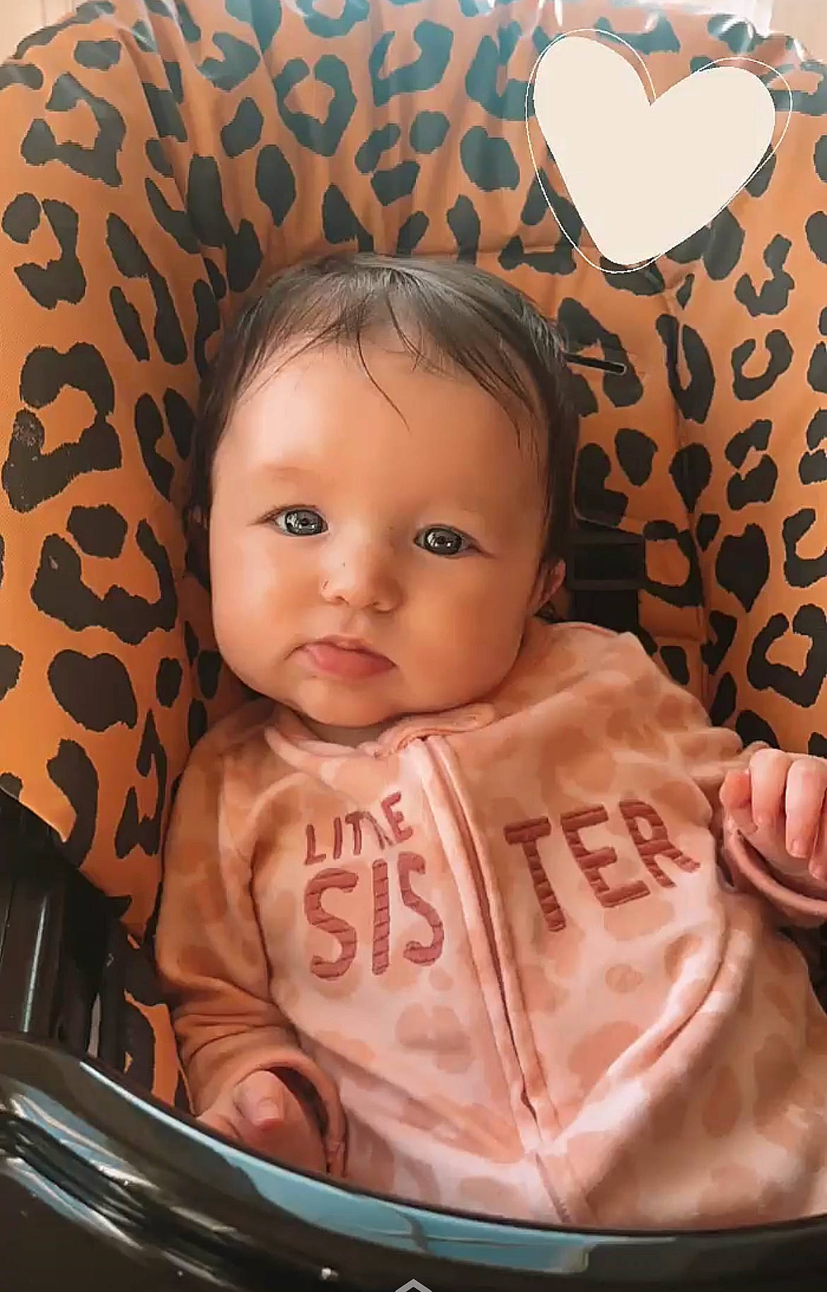 Vivian is registered to the contest to win money with this photo: baby, baby_carriage, baby_products, baby_toddler_clothing, bib, brown, cheek, child, chin, comfort, fun, happy, iris, linens, organ, pattern, person, sitting, skin, sleeve