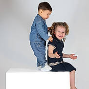 Milaya participe au concours pour gagner de l'argent avec cette photo : child, children, cube, curly_hair, cute, denim, dress, fashion, happy, laughing, person, playful, portrait, sitting, smile, standing, studio, toddler, white_background, white_shoes