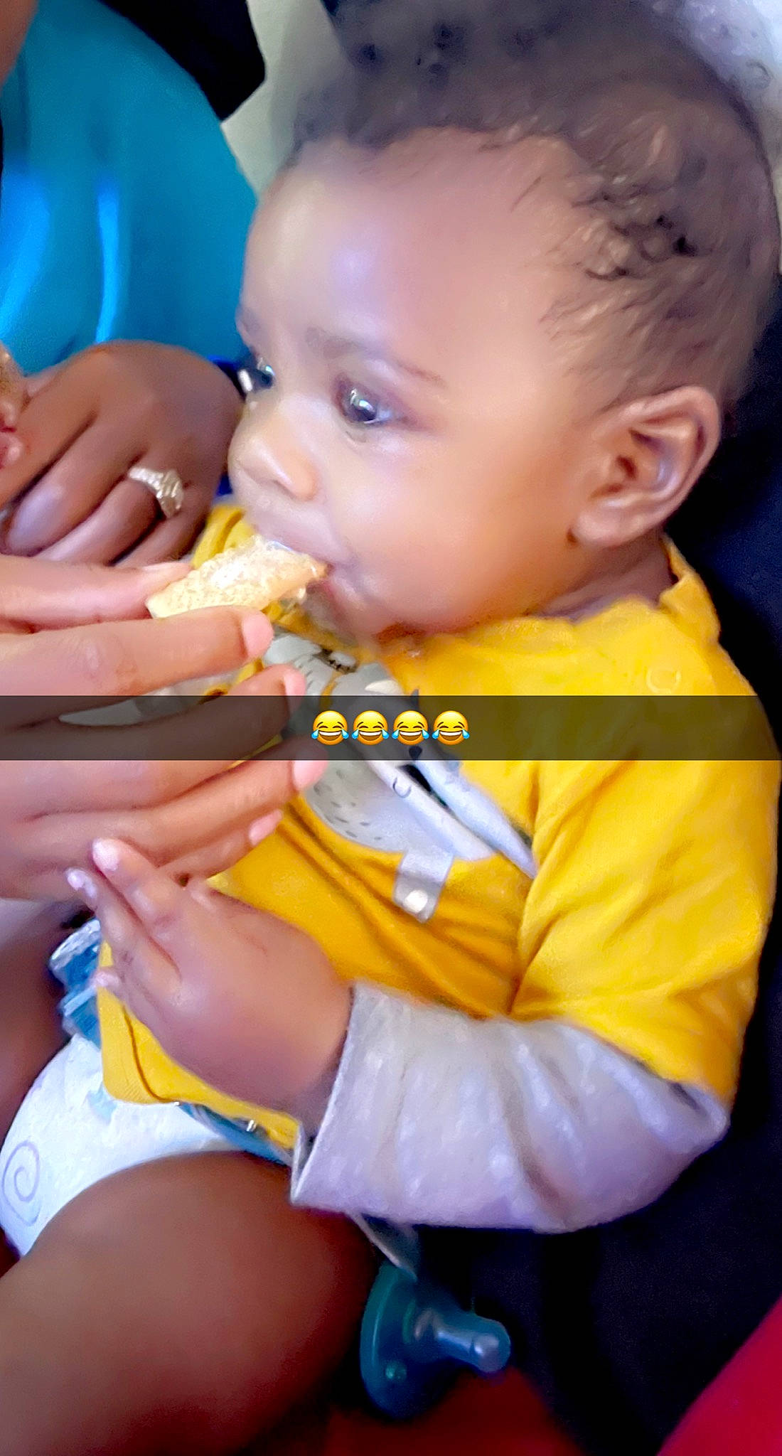 Jakai is registered to the contest to win money with this photo: baby, baby_toddler_clothing, blue, cheek, eye, face, finger, gesture, hand, happy, head, iris, lip, mouth, nail, nose, orange, person, skin, toddler