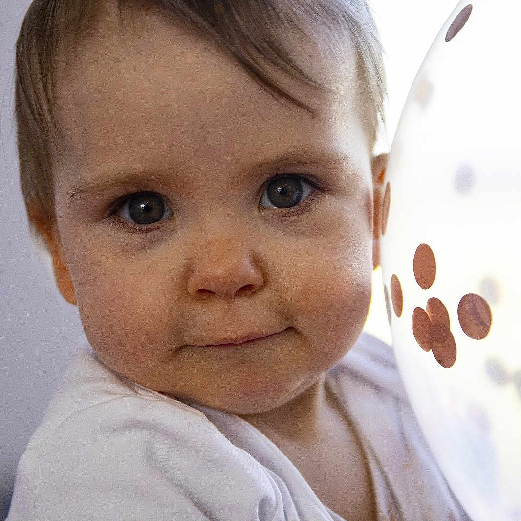Evie joined the competition — help win amazing prizes! baby, balloon, bodypart, face, finger, frown, hand, happy, head, mouth, newborn, pattern, person, photography, polkadot, portrait, sad, selfie, smile, sphere