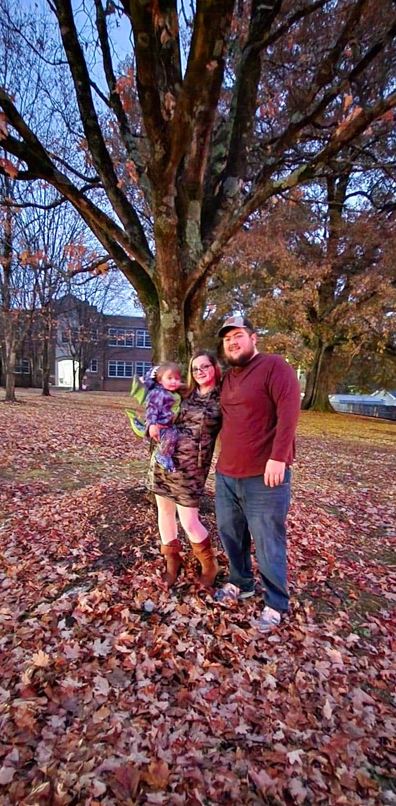 Alijah is registered to the contest to win money with this photo: blurred, branch, deciduous, forest, fun, gesture, grass, happy, headwear, joy, landscape, leisure, natural_landscape, people_in_nature, person, recreation, smile, tints_and_shades, tree, trunk