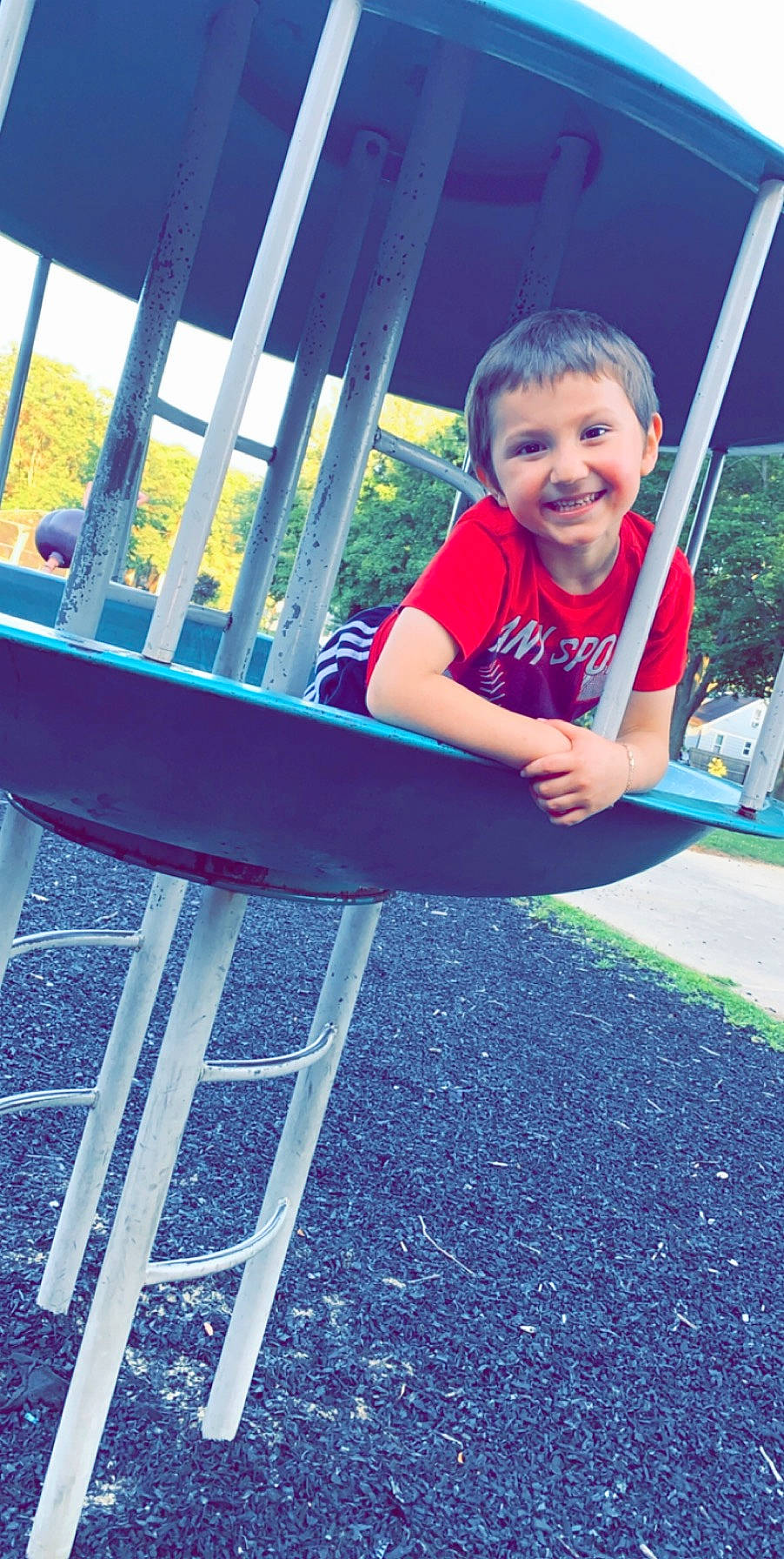 Anthony joined the competition — help win amazing prizes! child, city, fun, grass, human_settlement, joy, leisure, outdoor_play_equipment, person, plant, play, playground, public_space, recreation, smile, summer, swing, toddler, vacation
