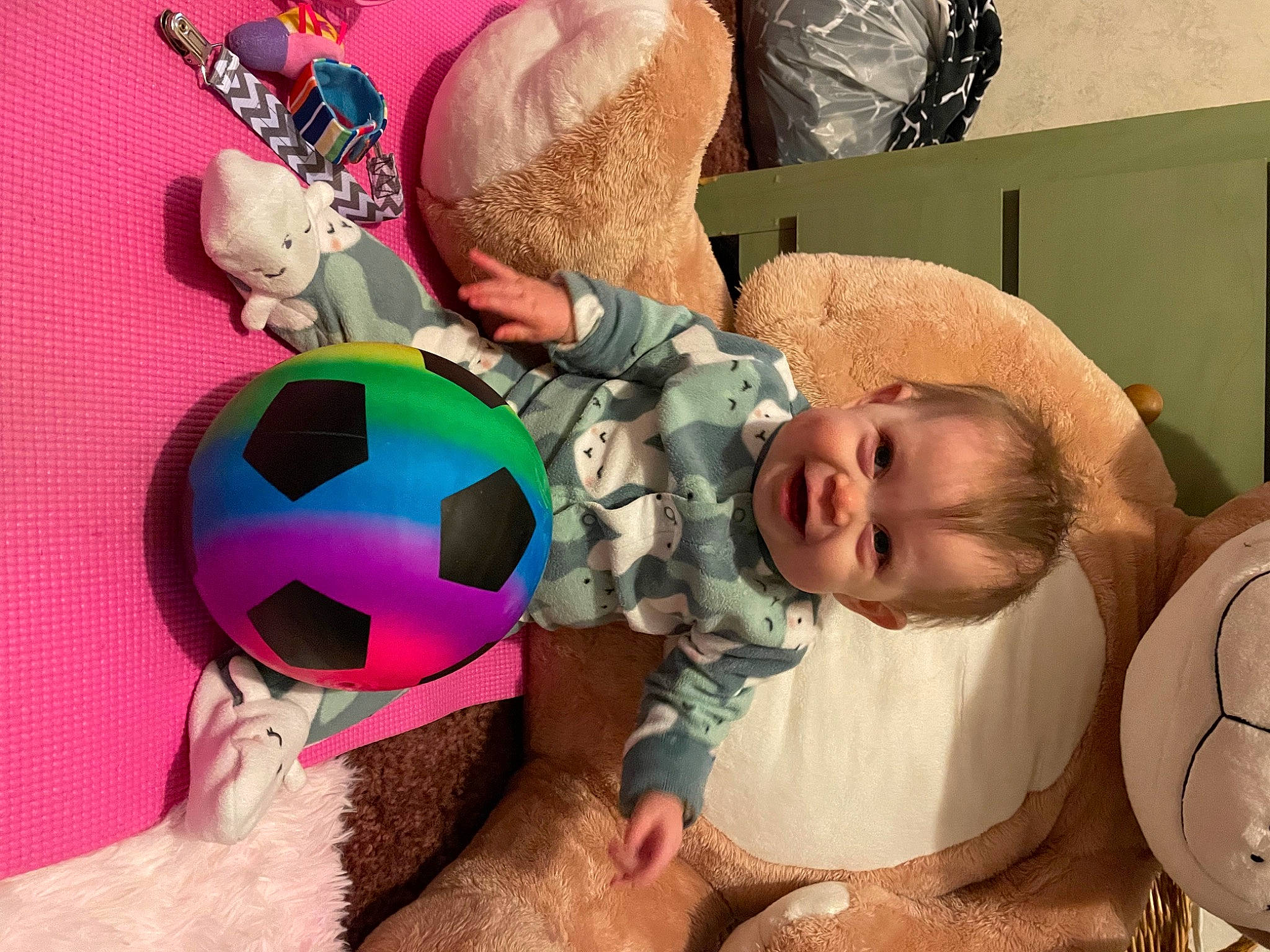 Abigail is registered to the contest to win money with this photo: baby, baby_products, baby_toddler_clothing, cheek, child, comfort, facial_expression, fashion_accessory, fun, happy, head, headgear, linens, mouth, pattern, person, pink, room, stuffed_toy, toddler