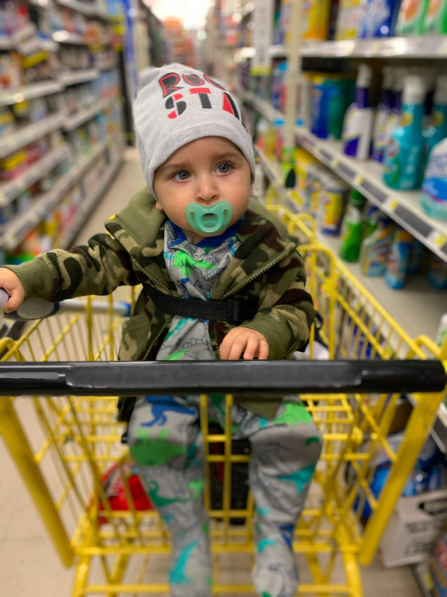 Dolph is registered to the contest to win money with this photo: baby, cart, child, fun, grocery_store, headgear, headwear, person, retail, shopping_cart, smile, supermarket, toddler, vehicle