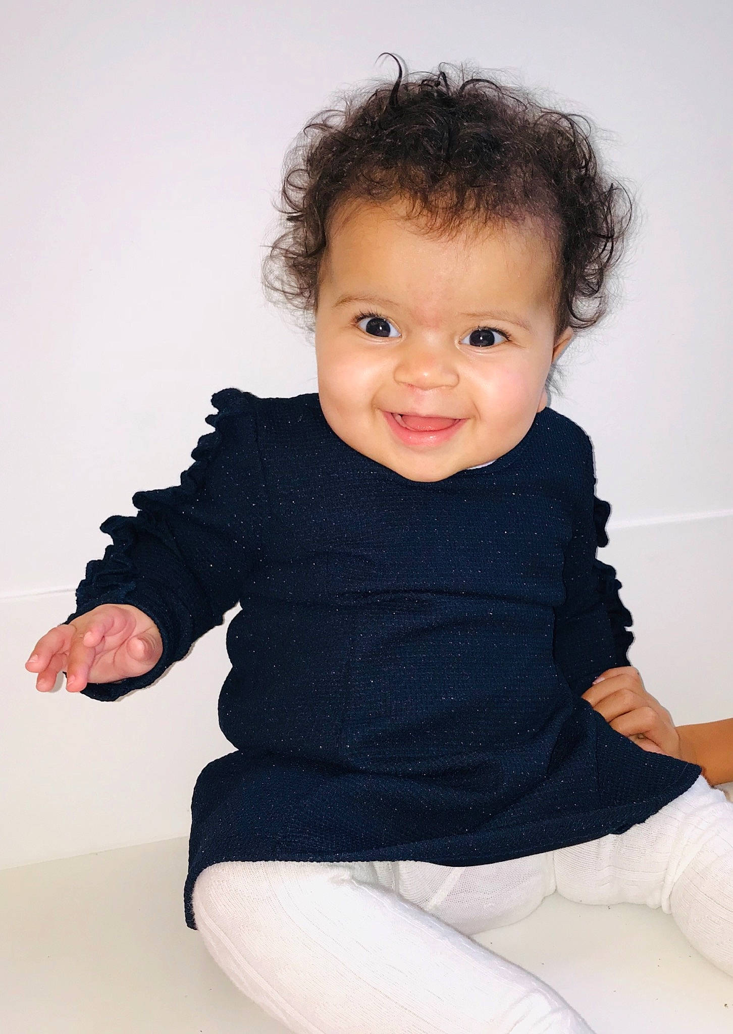 Mika is registered to the contest to win money with this photo: boy, child, child_model, fun, girl, infant, joy, neck, outerwear, person, shoulder, sitting, skin, sleeve, smile, standing, sweater, textile, toddler, top