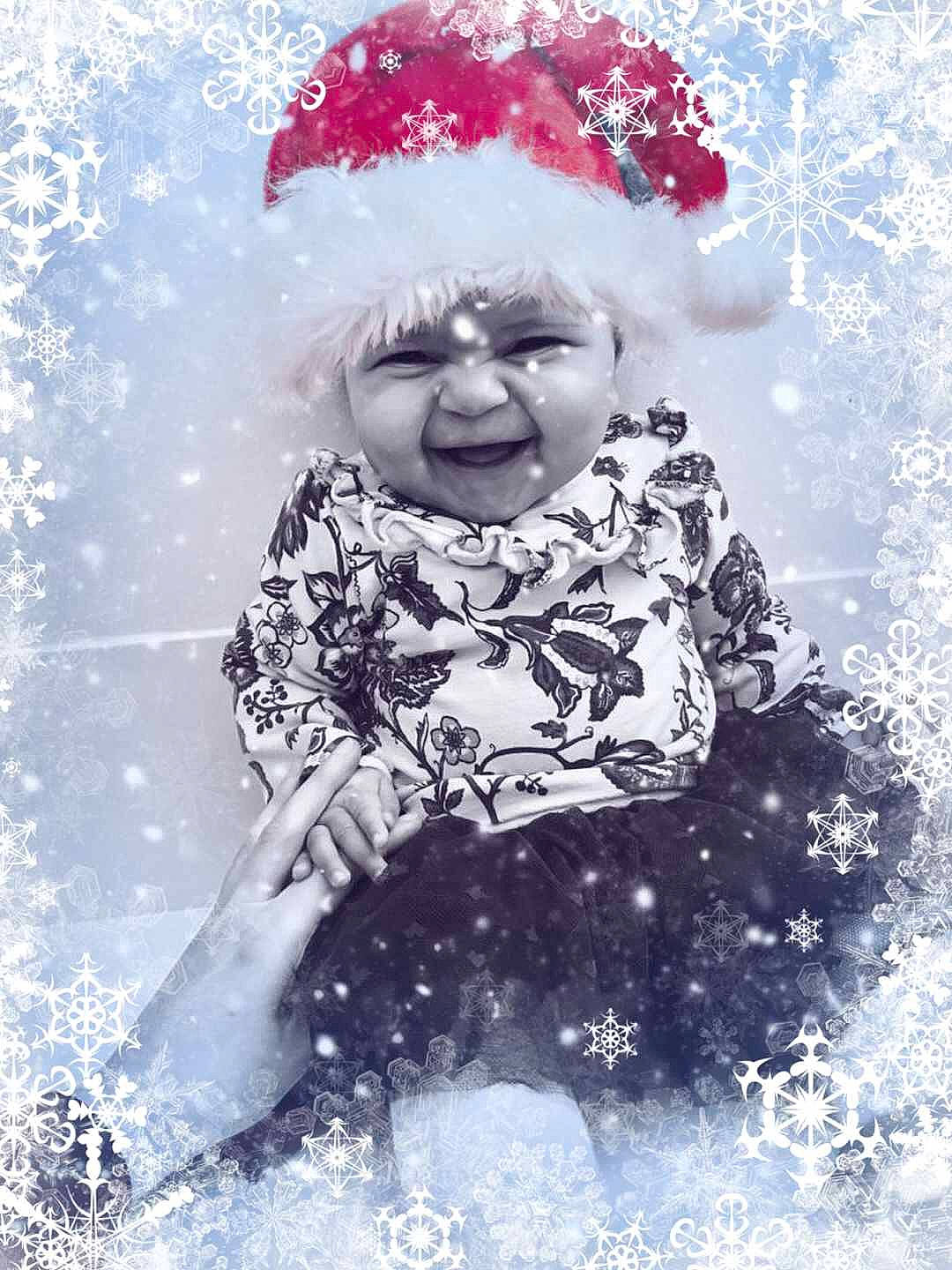 Mika is registered to the contest to win money with this photo: child, christmas, fictional_character, freezing, fun, girl, happiness, holiday, joy, person, photograph, smile, snow, toddler, tree, winter