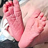 baby_feet, toes, skin, wrinkles, close_up, pink, infant, foot, small, delicate, barefoot, human, newborn, soft, cute, detail, resting, skin_texture, background_blur, white_strap