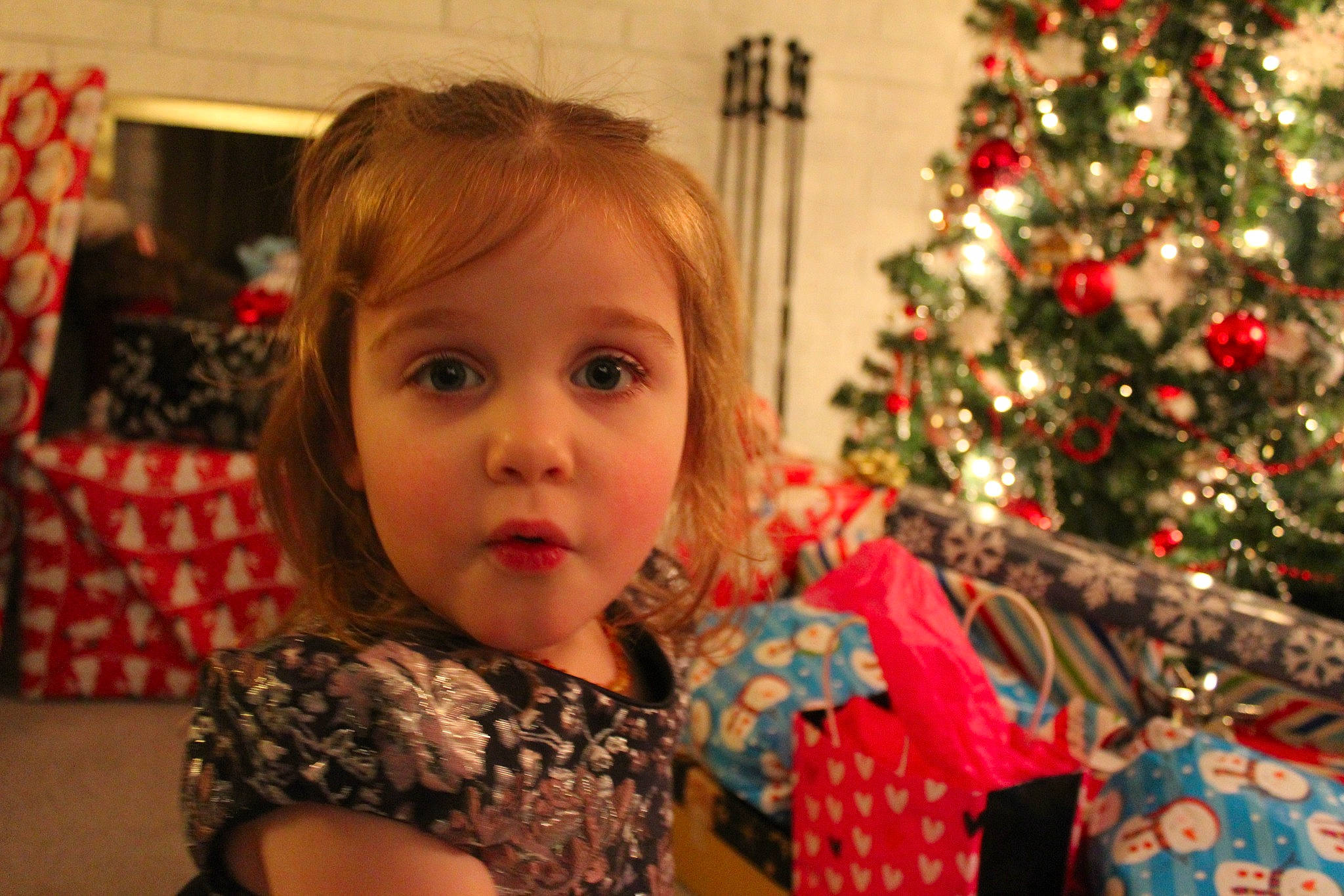 Isla joined the competition — help win amazing prizes! cheek, child, christmas_decoration, christmas_ornament, christmas_tree, event, eye, facial_expression, fun, hairstyle, happy, head, holiday_ornament, human_body, organ, ornament, person, plant, red, toddler