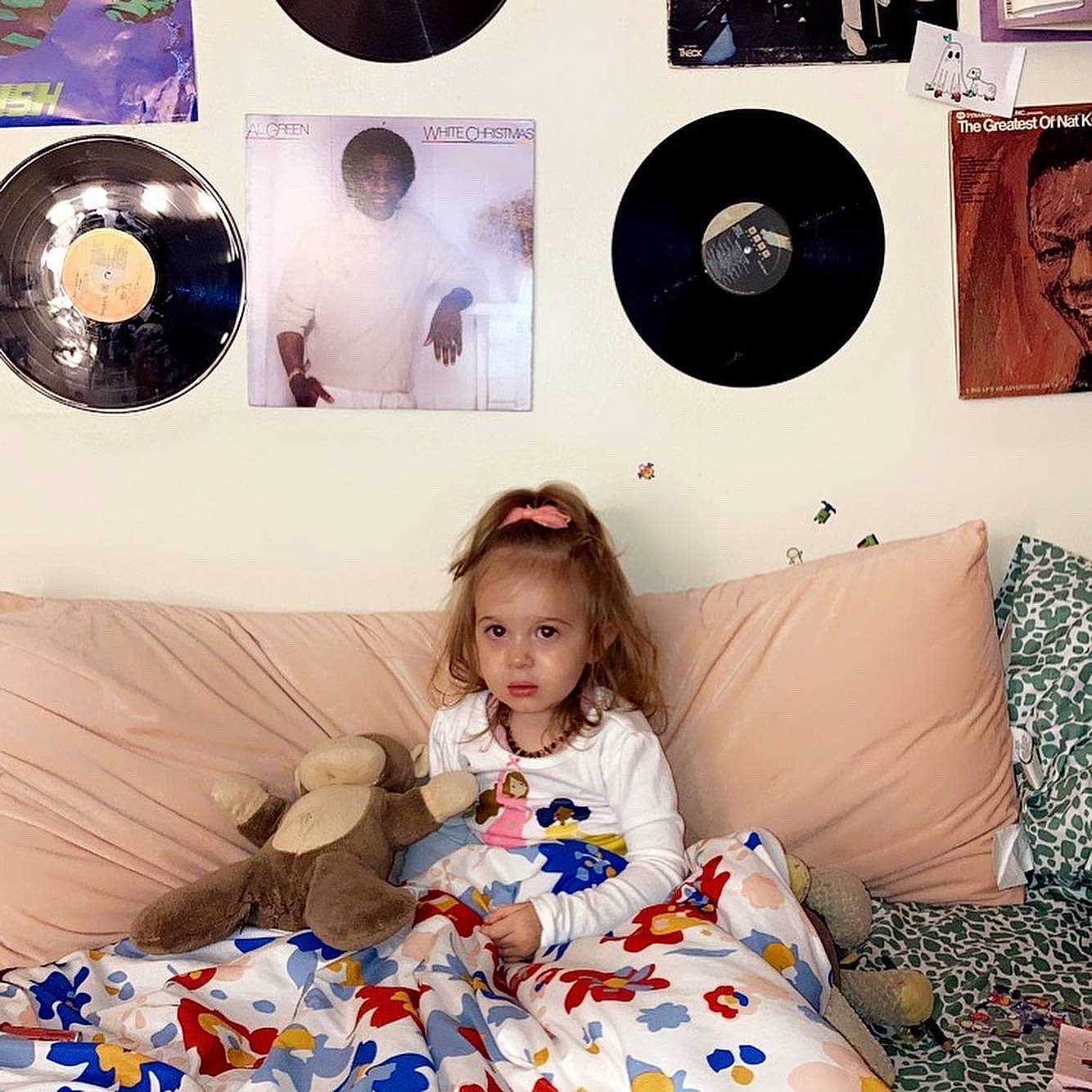 Estella is registered to the contest to win money with this photo: art, baby_toddler_clothing, beauty, comfort, electronic_device, facial_expression, fashion, gramophone_record, happy, joy, mammal, people, person, photograph, picture_frame, pillow, product, snapshot, t_shirt, textile