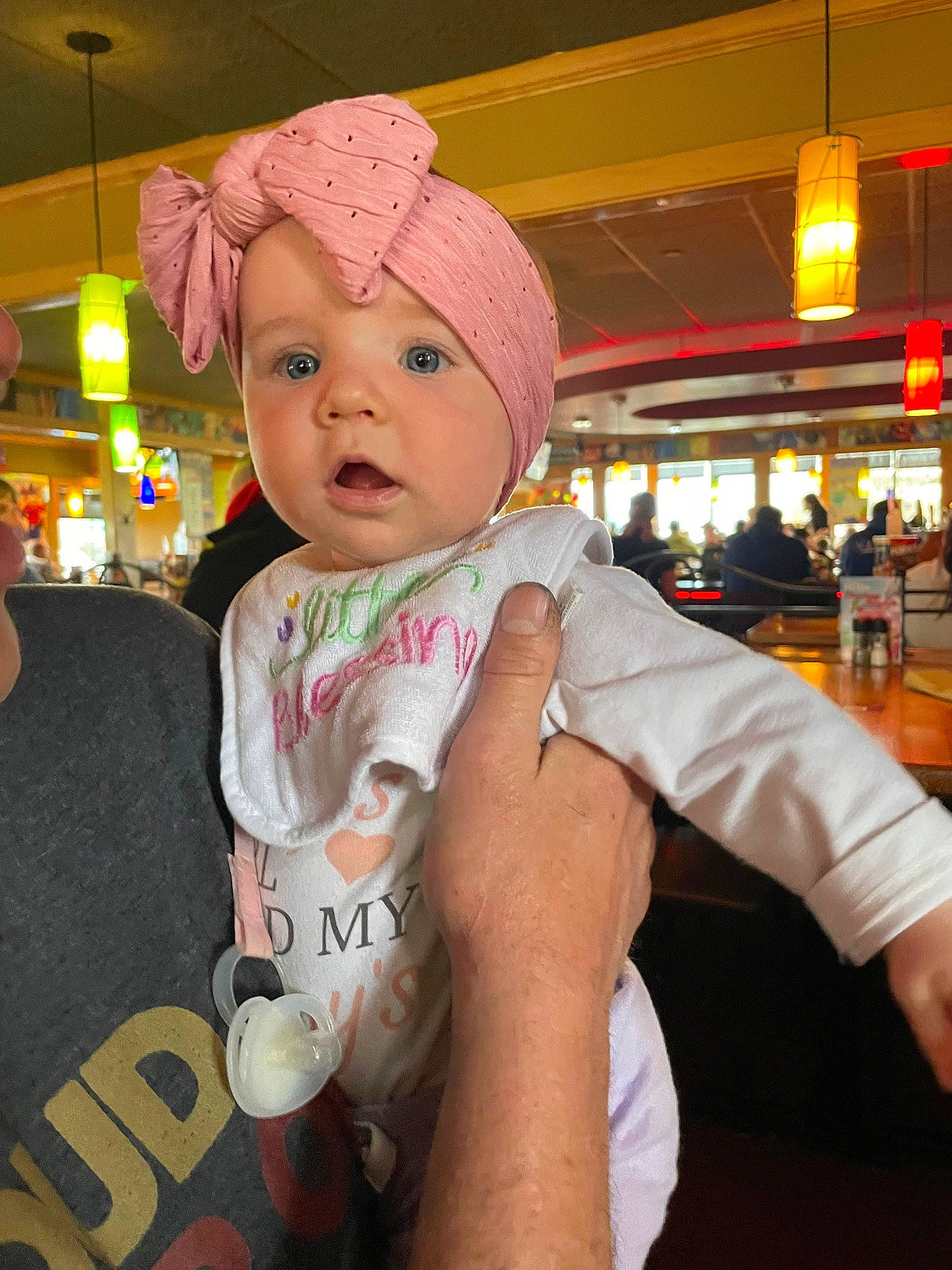 Gemma joined the competition — help win amazing prizes! baby, baby_toddler_clothing, beanie, cap, child, cool, costume_hat, event, fashion_accessory, fun, gesture, happy, headwear, leisure, magenta, person, room, sleeve, t_shirt, thumb