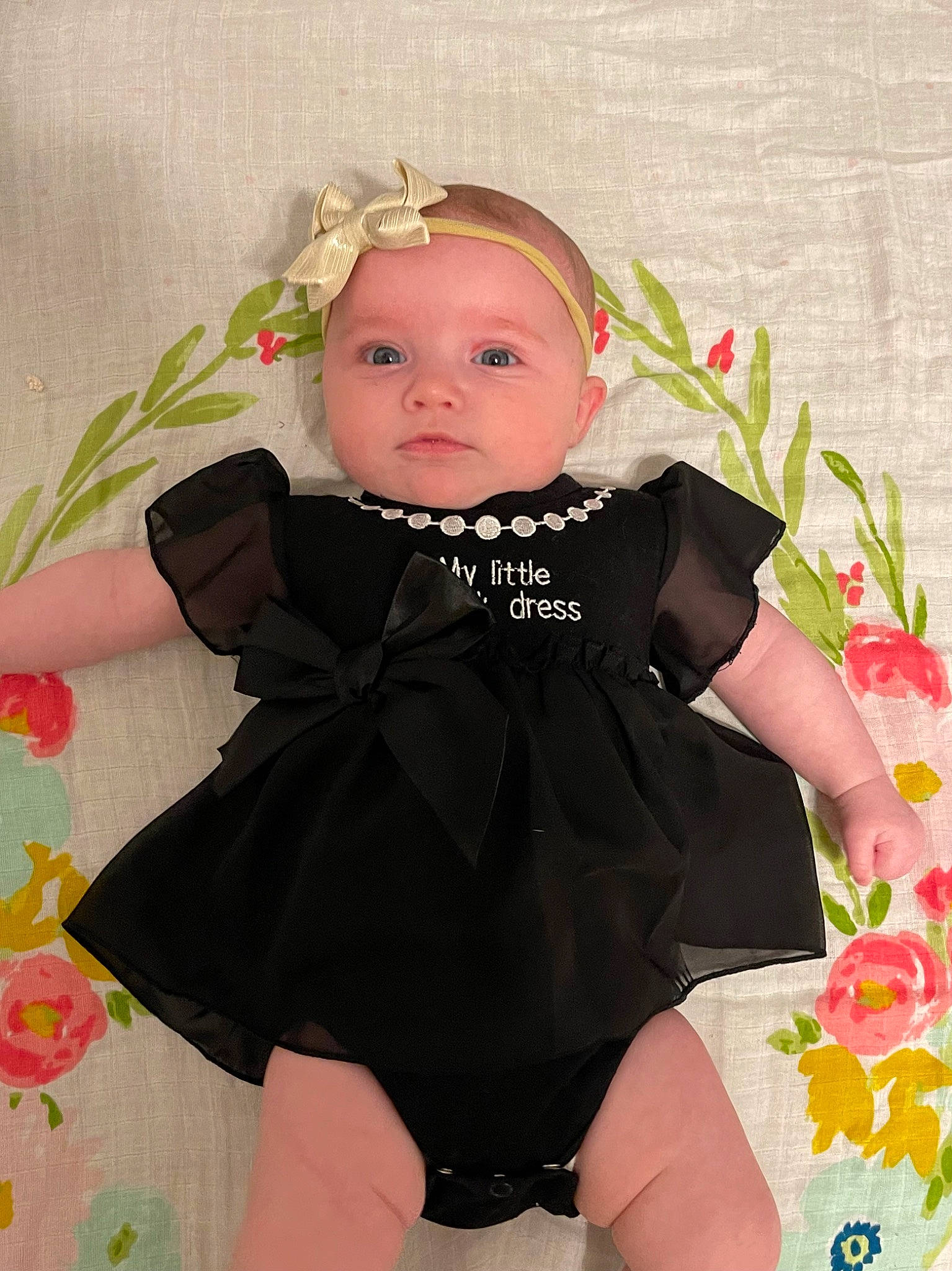 Presley joined the competition — help win amazing prizes! baby, baby_products, baby_toddler_clothing, cheek, child, day_dress, dress, embellishment, face, happy, hat, head, iris, one_piece_garment, pattern, person, petal, pink, skin, sleeve