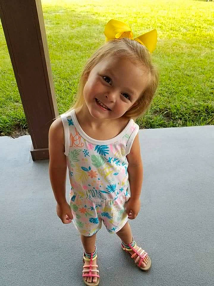 Madison is registered to the contest to win money with this photo: baby, baby_toddler_clothing, child, dress, fun, grass, happy, joy, person, plant, play, shoe, skin, smile, standing, summer, t_shirt, toddler, vacation, walking