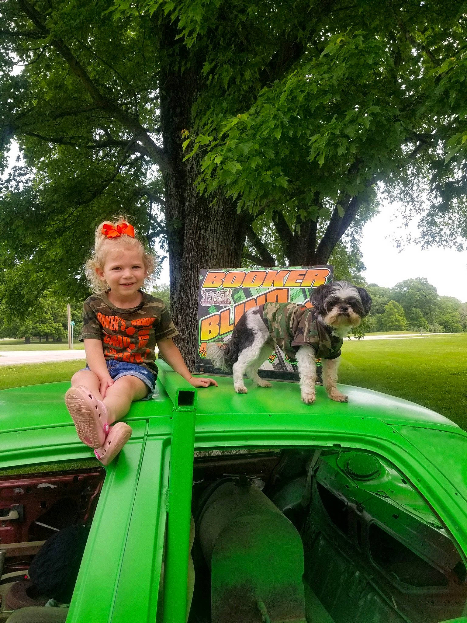 Sutton joined the competition — help win amazing prizes! auto_part, automotive_exterior, automotive_window_part, carnivore, child, fun, grass, green, joy, jungle, leisure, motor_vehicle, person, plant, play, recreation, shorts, sitting, t_shirt, toddler