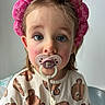 baby, bear_pattern, blue_eyes, child, closeup, clothing, cute, expression, face, headband, indoor, infant, long_sleeve, pacifier, person, pink, portrait, sitting, toddler, young_child