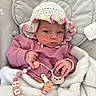 baby, beaded_toy, blanket, child, close_up, clothing, crocheted_hat, cushion, cute, face, hand, indoor, infant, lying_down, pacifier, person, pink_sweater, red_spots, resting, soft_texture